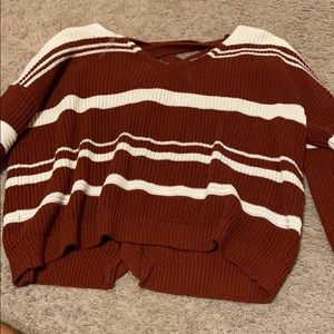 red and white sweater with braided back
